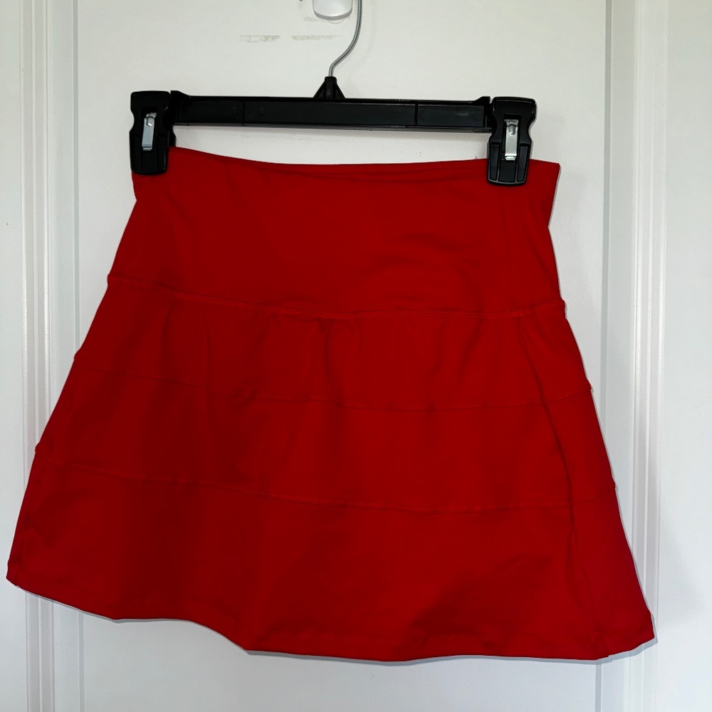Red mini tennis skirt